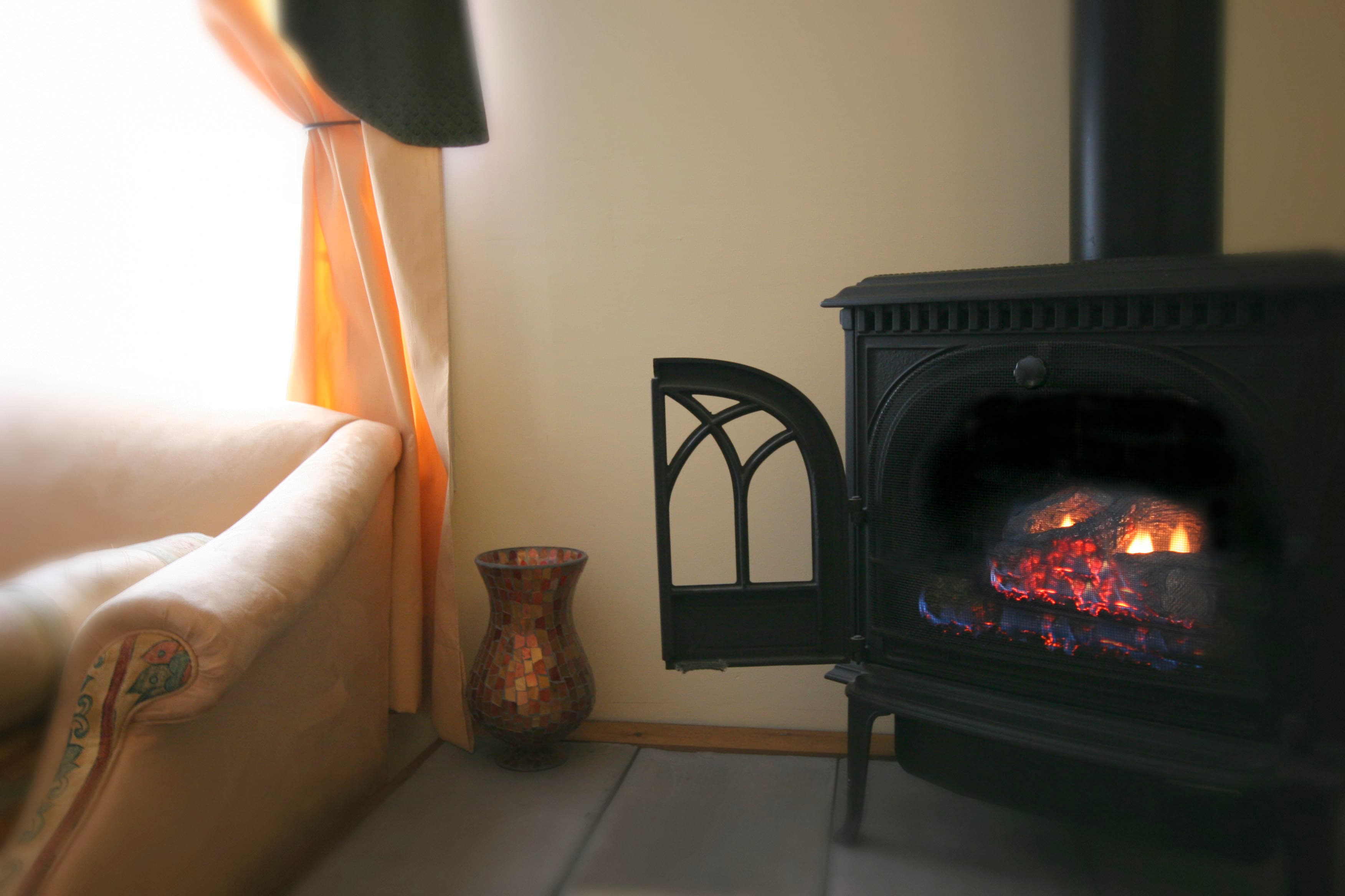 Lair 3 gas fireplace stove with a lovely fire lit.