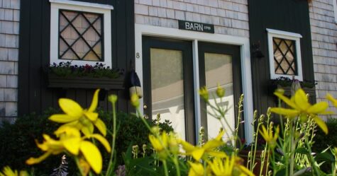 Barn entrance green doors with flowers