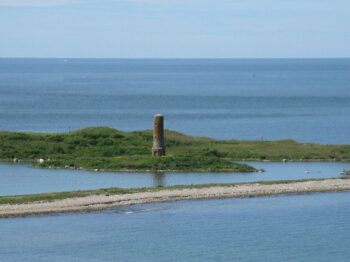 Gasnoid Monument on island surrounded by blue water