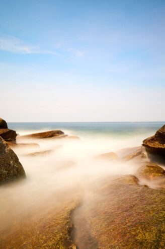 The ocean breaks through the rocks