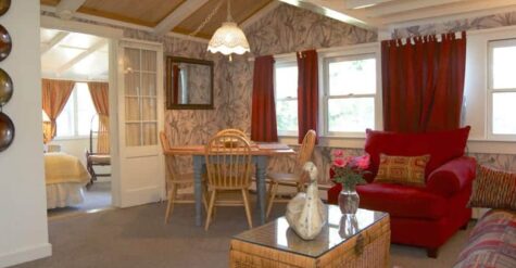 Living room of suite with dark red shades