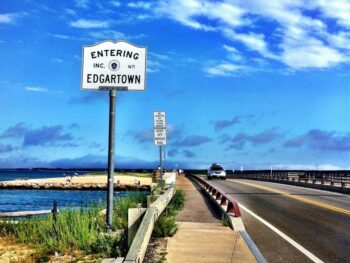 sign on side of bridge saying 