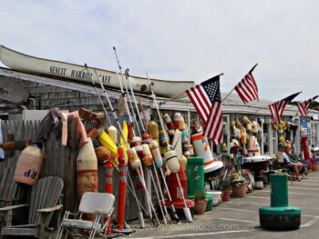 various items in front of building with boat on top